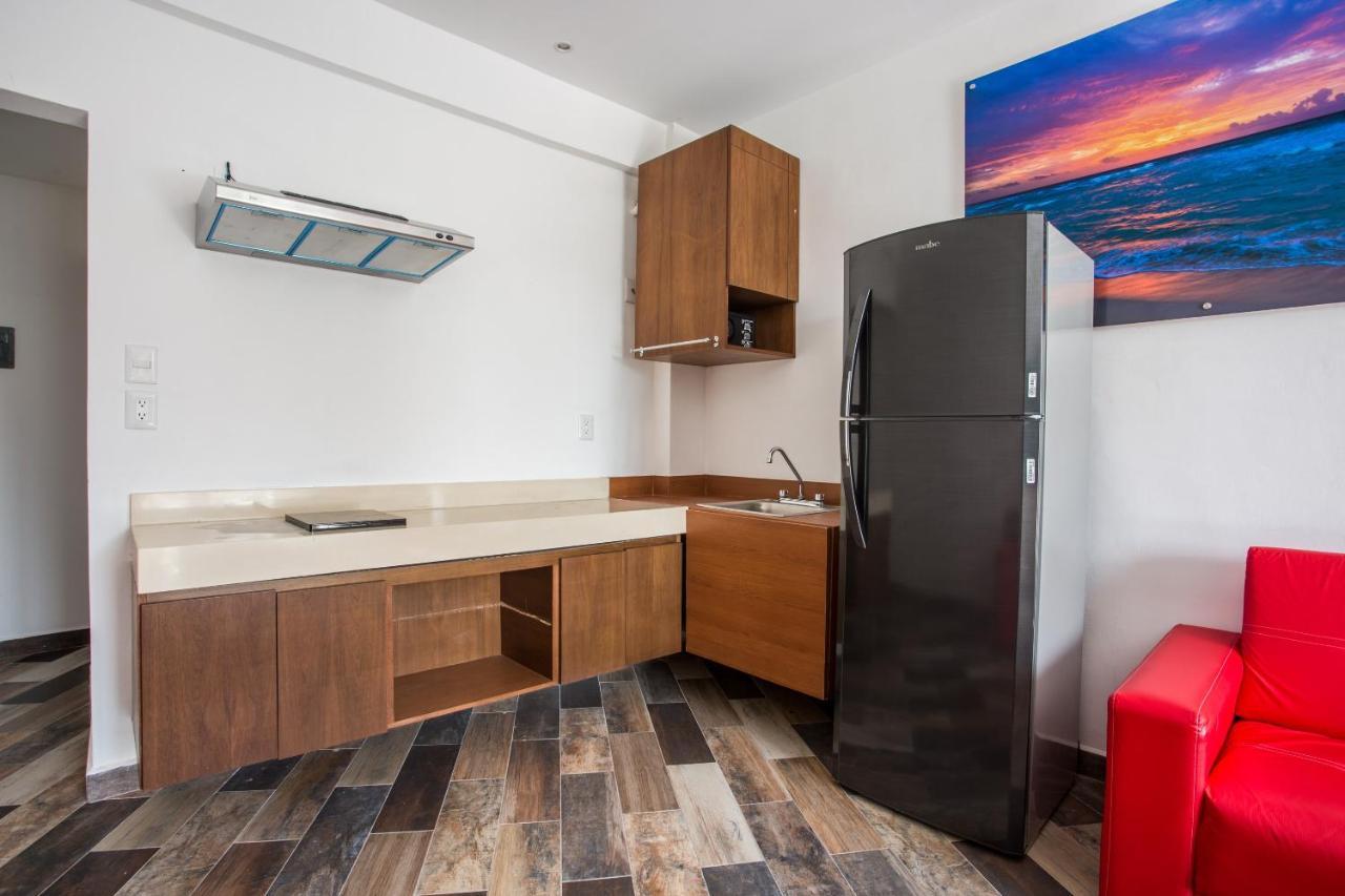 Capital O Cancun Ocean View, Cancún Kültér fotó A typical kitchen in a studio apartment